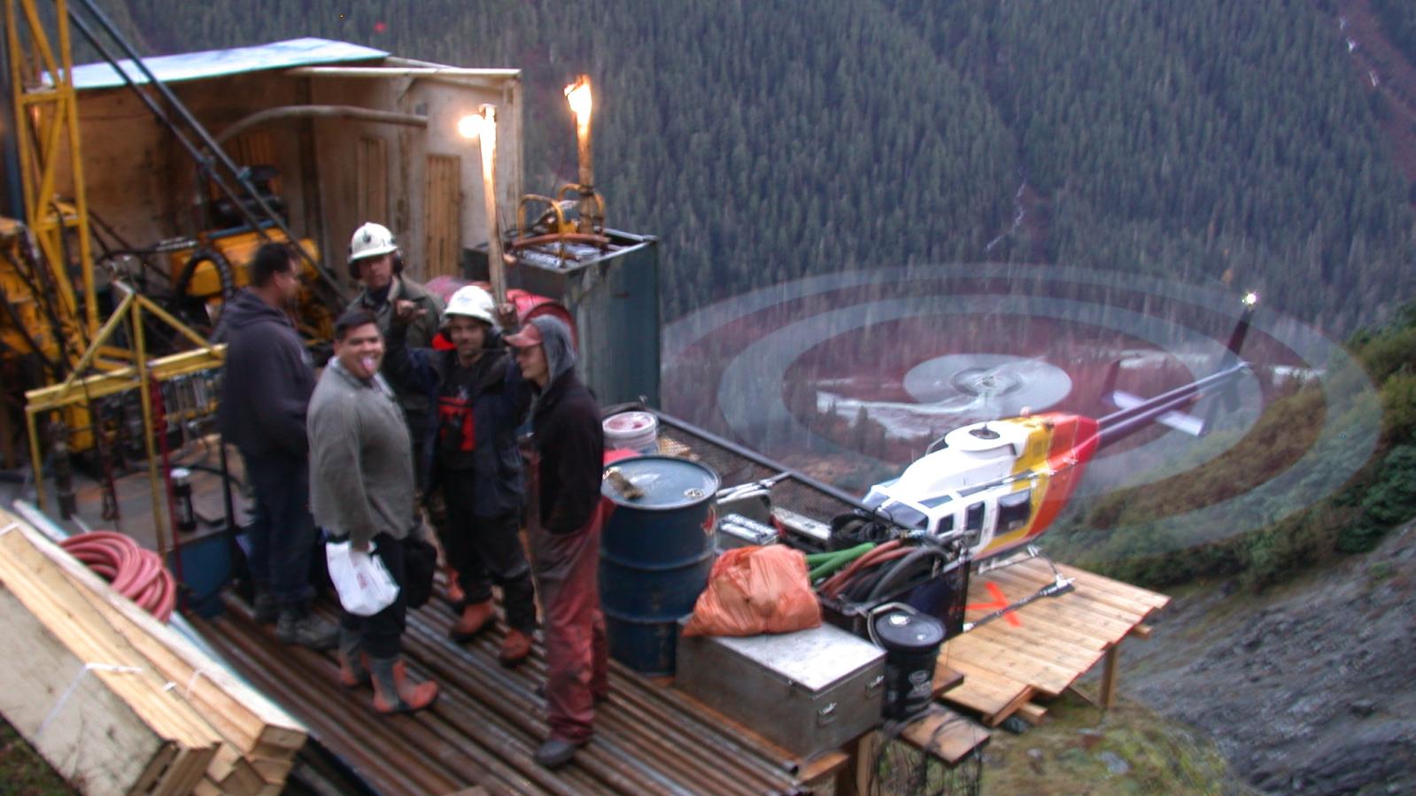 Helicopter landing at drill pad during drilling at the Rico Zone