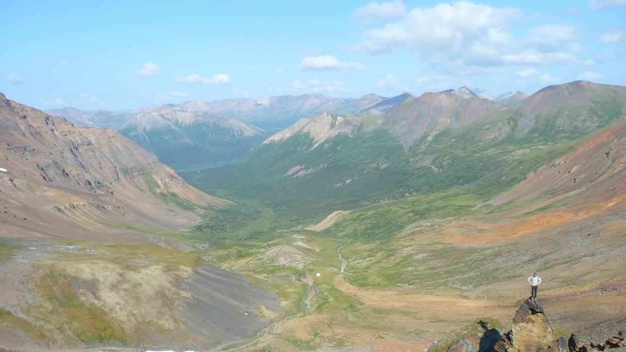 Yukon Mountains Landscape with Geologist in Foreground Yukon Mountains Landscape with Geologist in Foreground